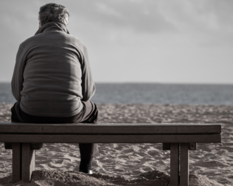 Elderly Man Isolated on A Bench