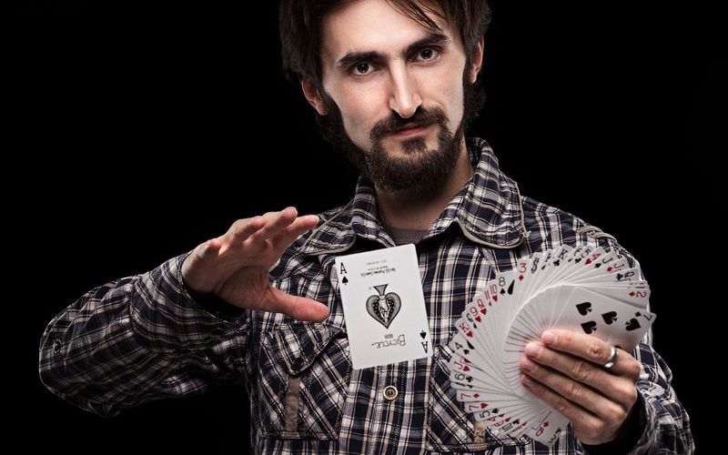 magician completing a card trick