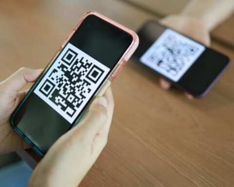 smart phone showing QR Code
