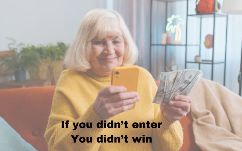 Older adult woman looking at her phone, with money in her hand